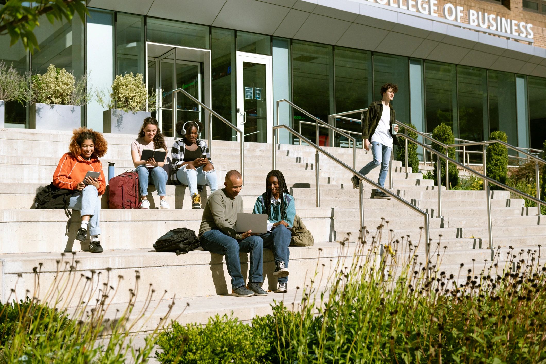 Students working together outside a university building