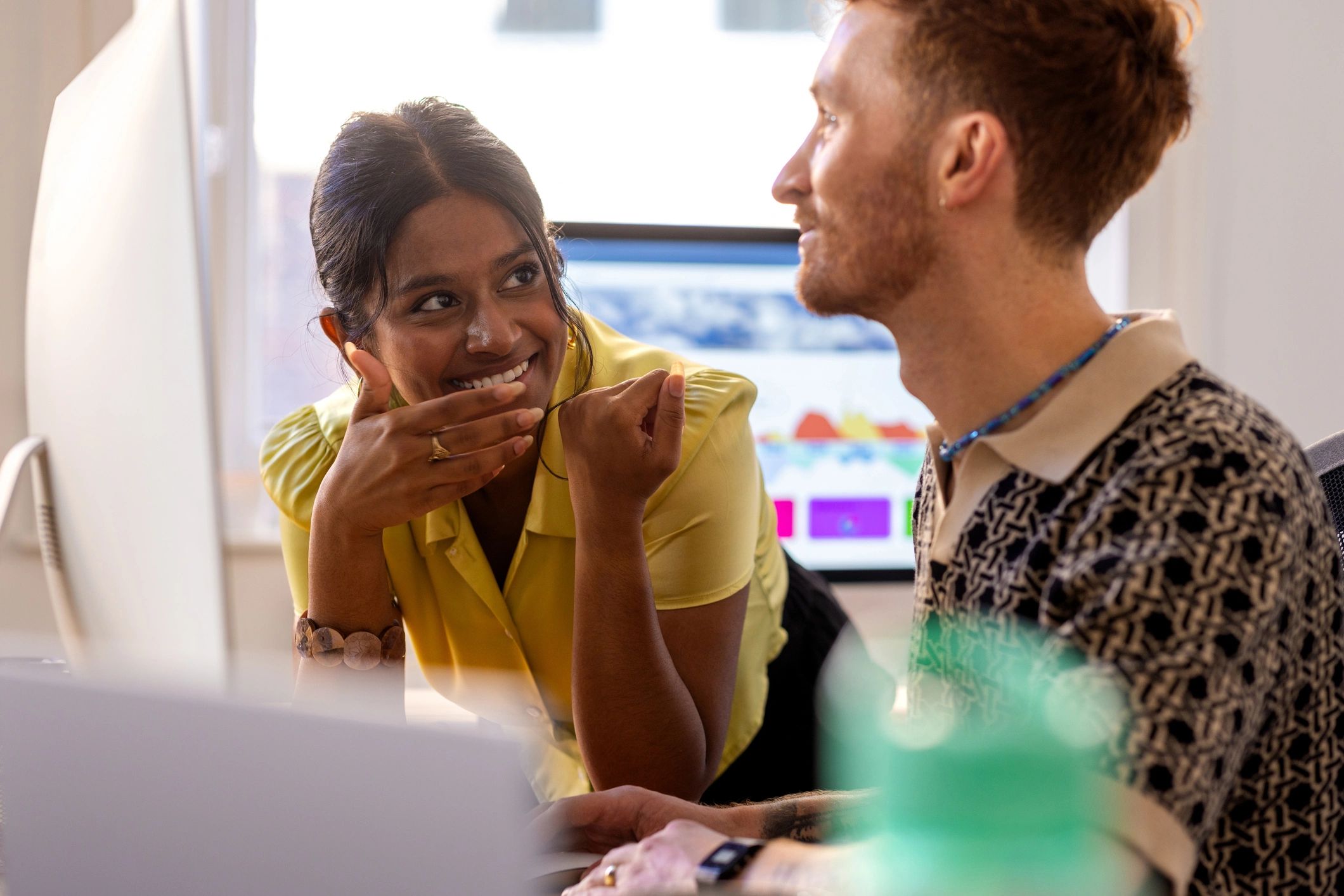Advisor discussing plans with a student in an office
