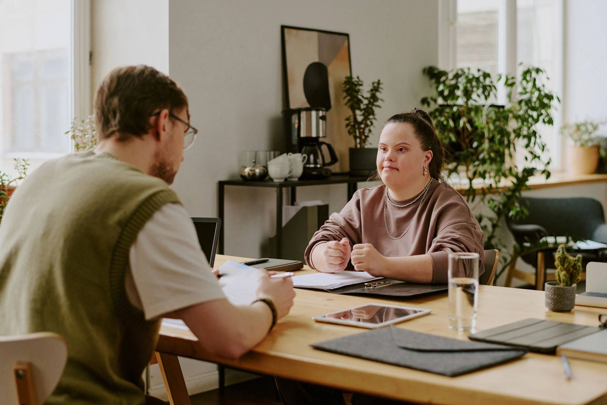 Advisor meeting with a client in a professional office